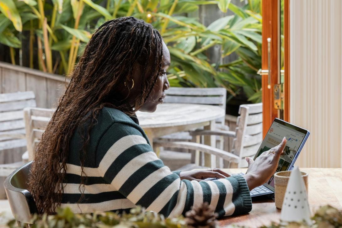 Black woman on computer.